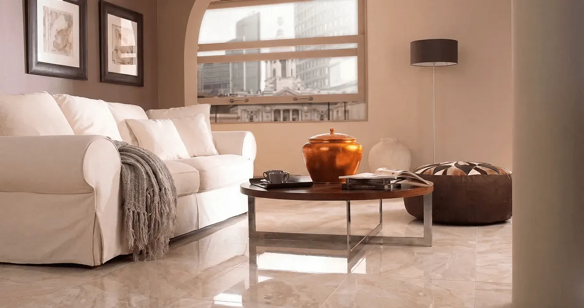 Modern living room with professionally installed marble flooring, a beige sofa, coffee table in New Haven, CT