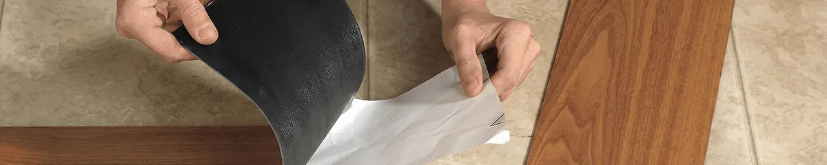A professional installing vinyl flooring in New Haven, CT